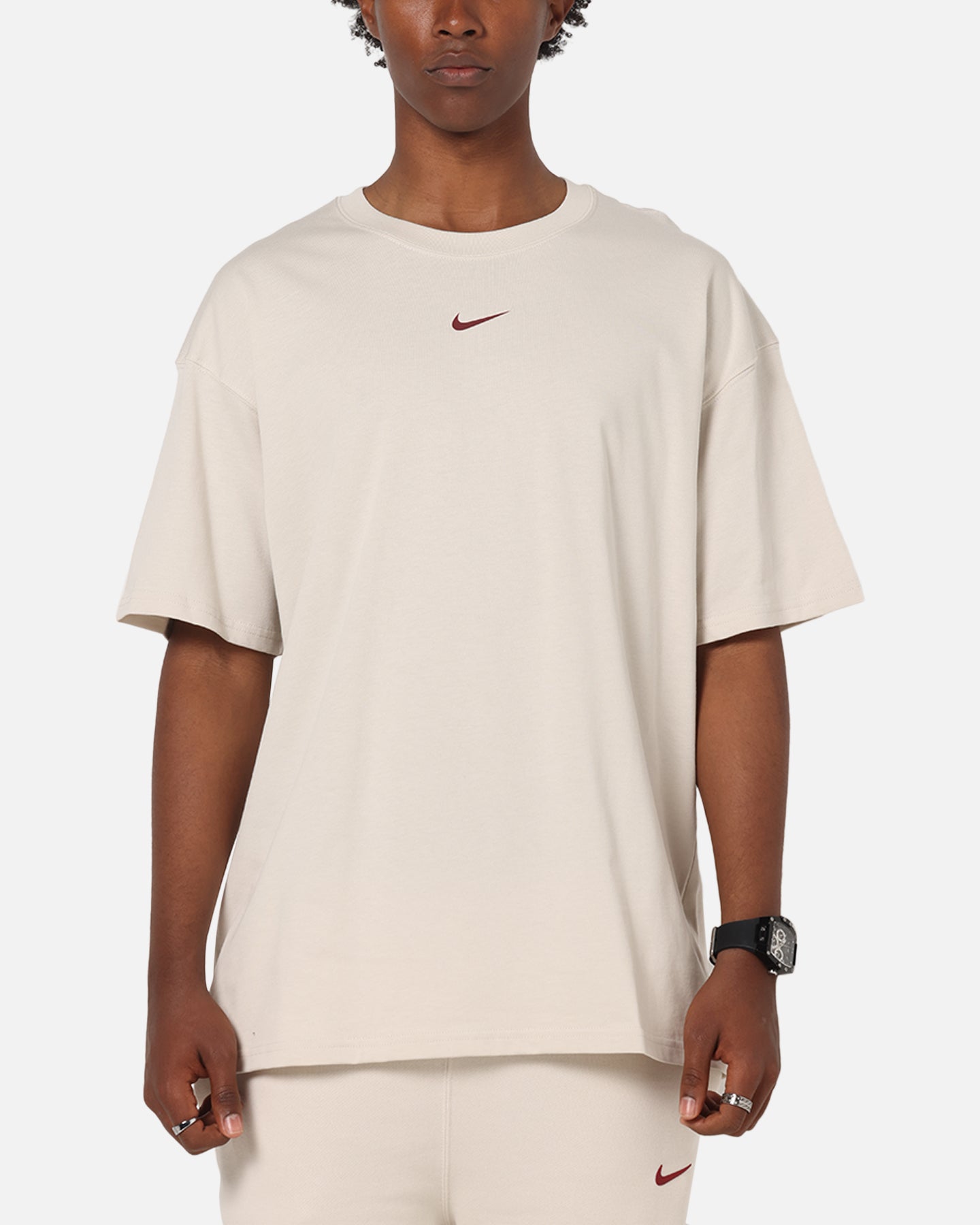 white and brown nike shirt