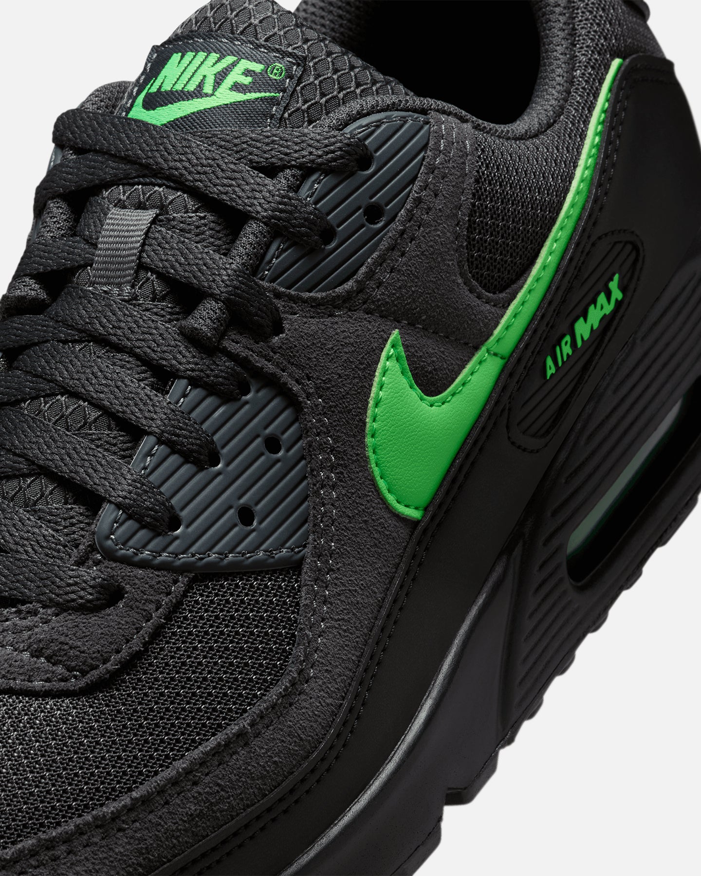 black nike shoes with green tick